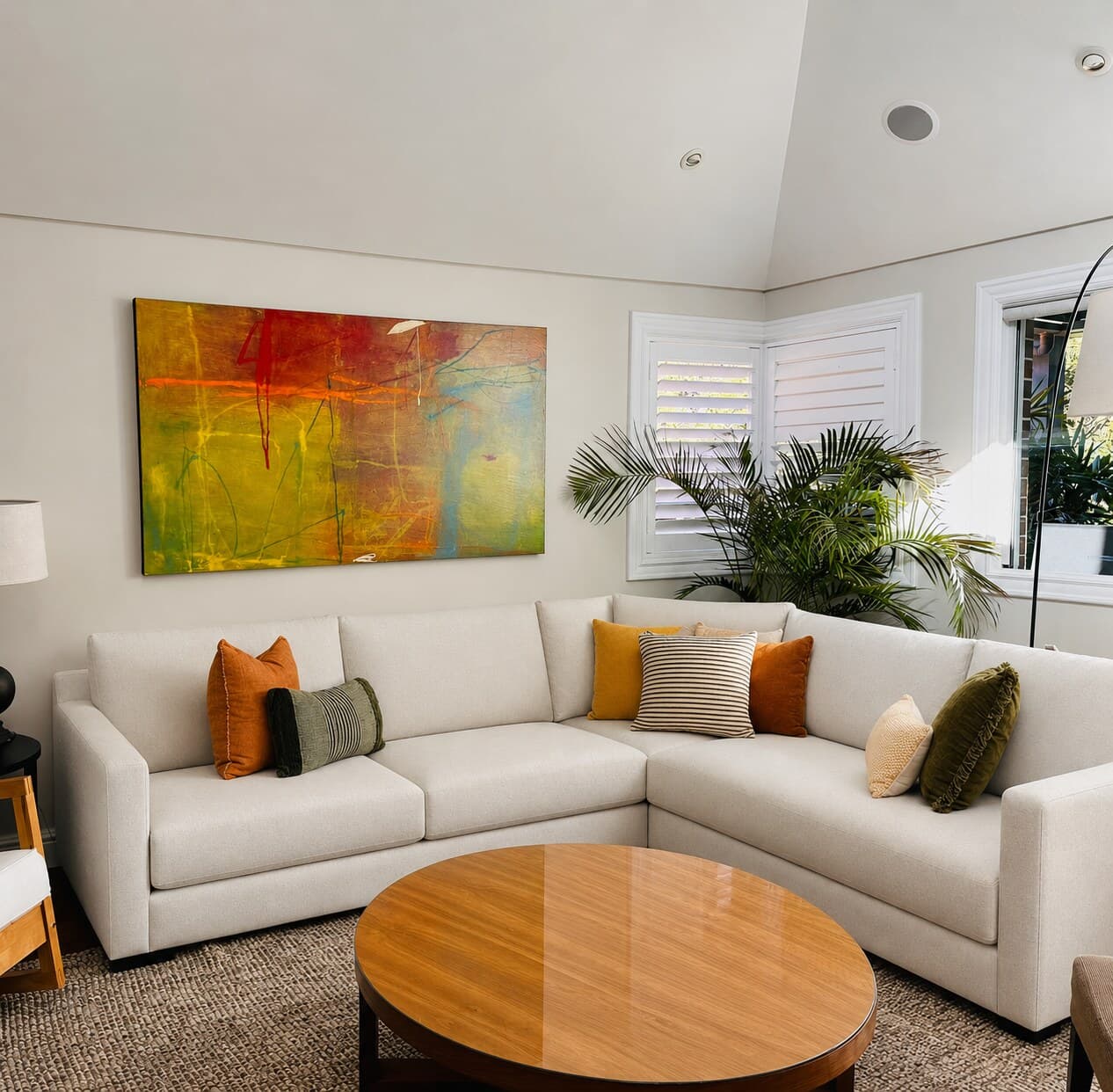 A bright Sydney living room with a cream sofa and abstract artwork